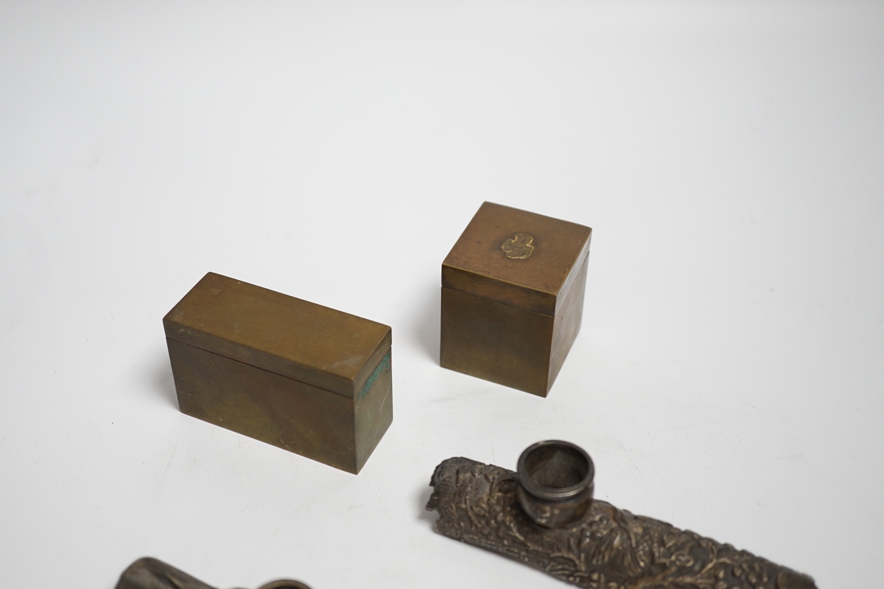 Two white metal opium pipe heads and two opium boxes (mid 20th century)